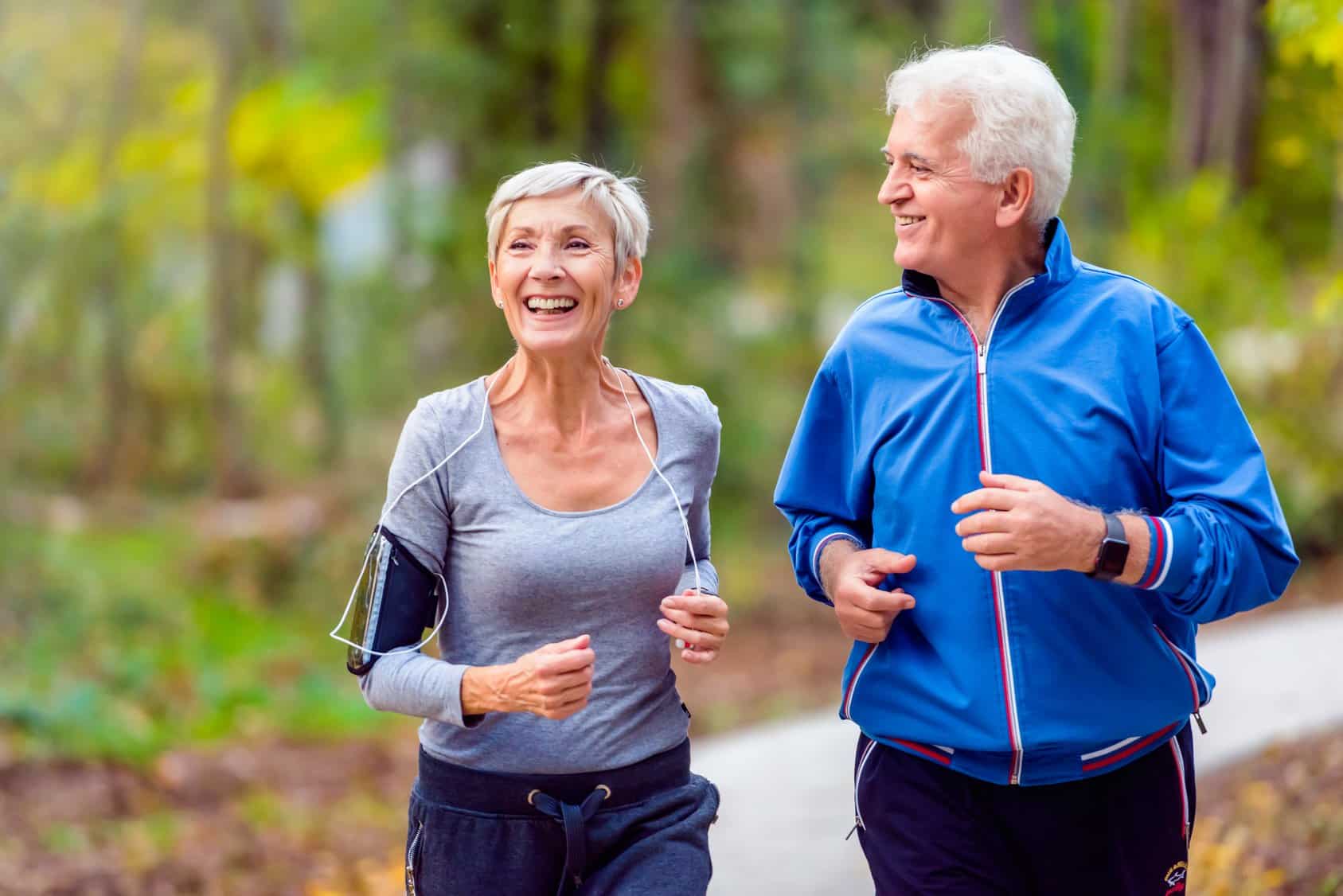 elderly couple running